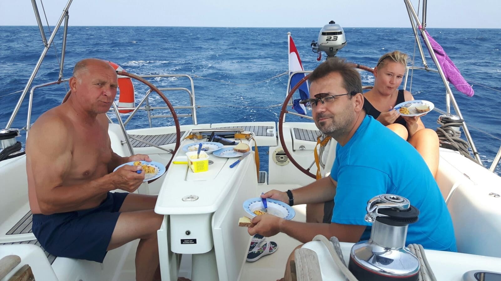 Delivery crew having breakfast in the cockpit of the Oceanis 40 on the Ionian leg from Corfu to Lavrio Delivery crew having breakfast in the cockpit of the Oceanis 40 on the Ionian leg from Corfu to Lavrio
