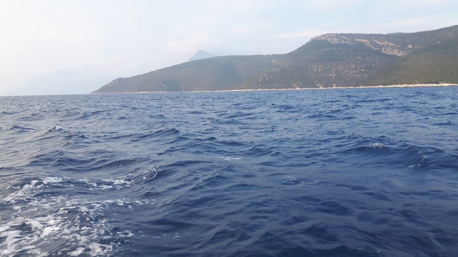 Greek island coastline seen from the Oceanis 40 on the way to the Corinth Canal