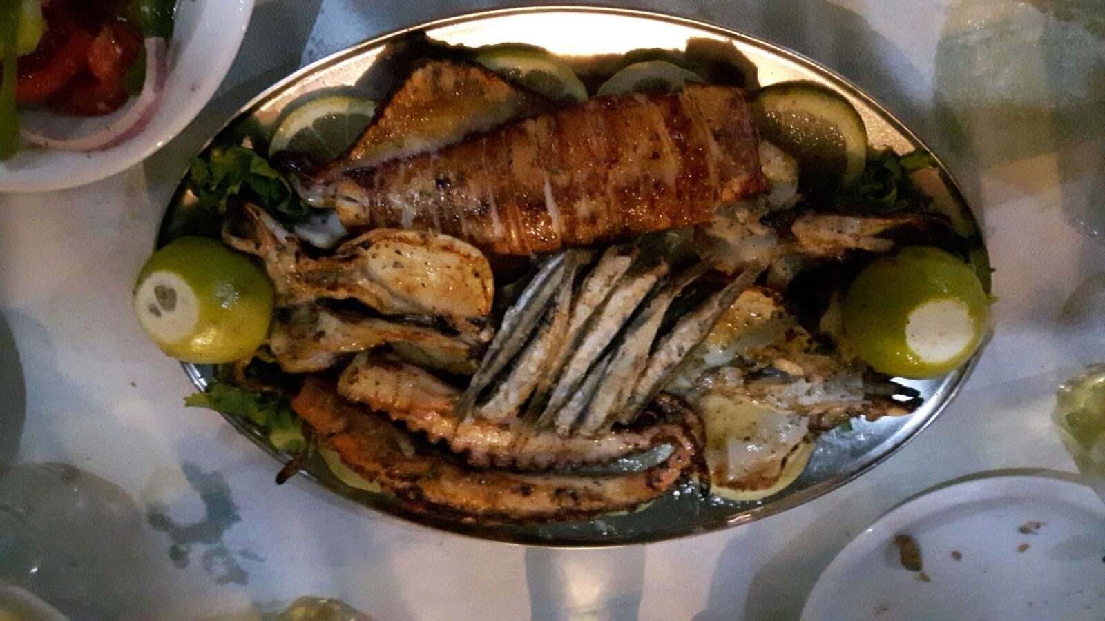Grilled fish dinner ashore in Greece during the Oceanis 40 yacht delivery from Koper to Lavrio