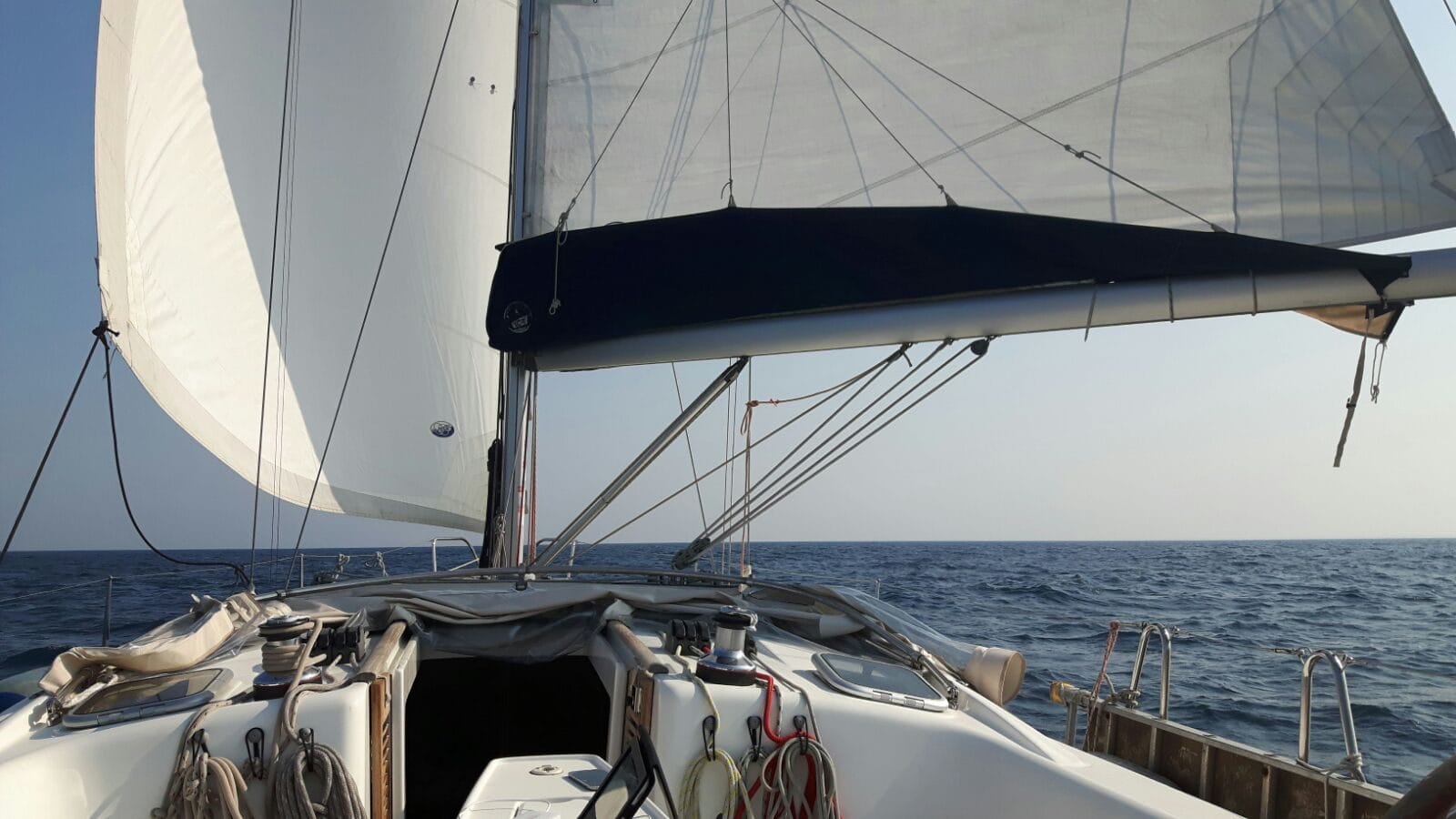Sails and cockpit of the Beneteau Oceanis 40 under way on the Adriatic