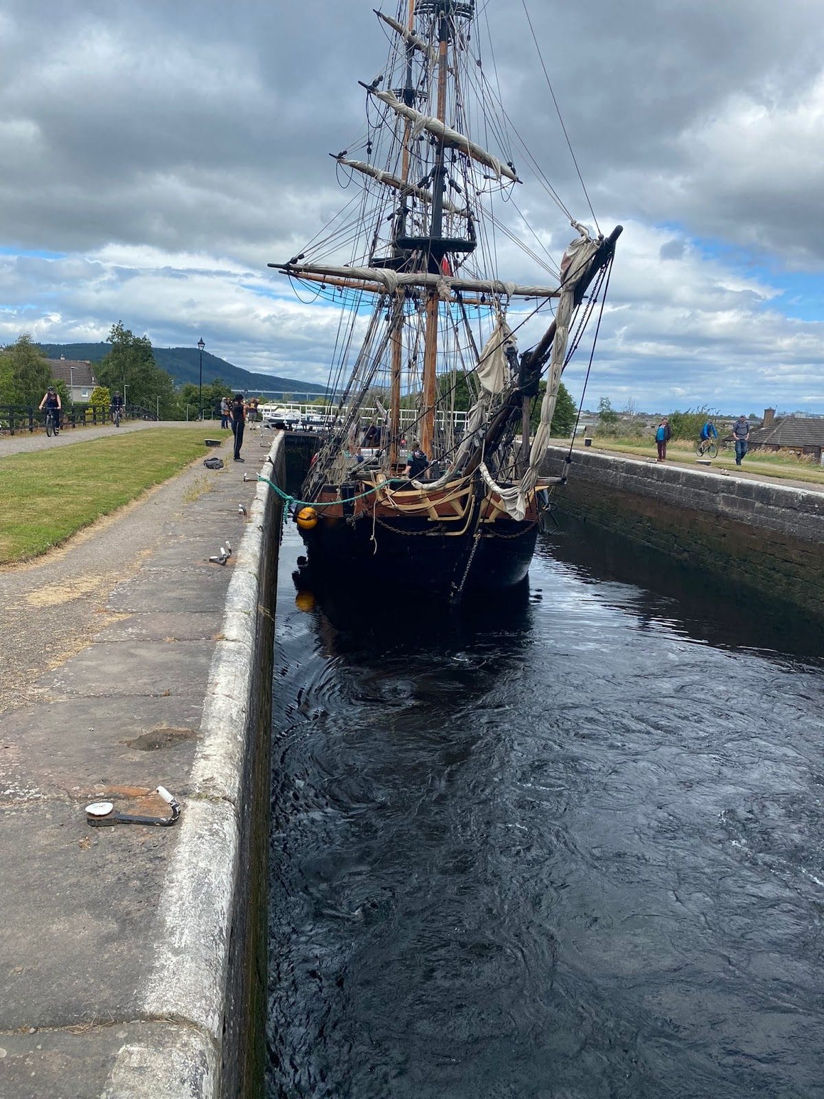 Tall ship Phoenix only just fitting in a lock of the Caledonian Canal